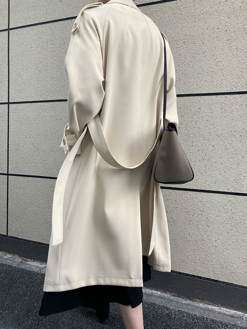 Drapey British style loose mid-length trench coat