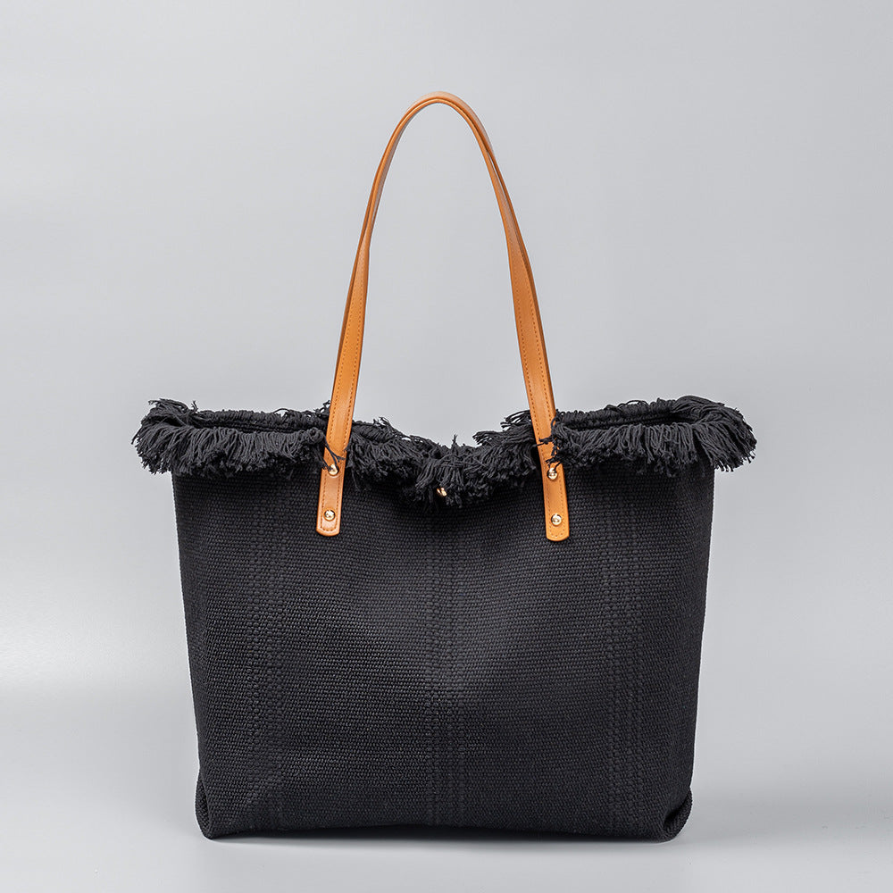 Bolso tote chic de lona con bordes con flecos