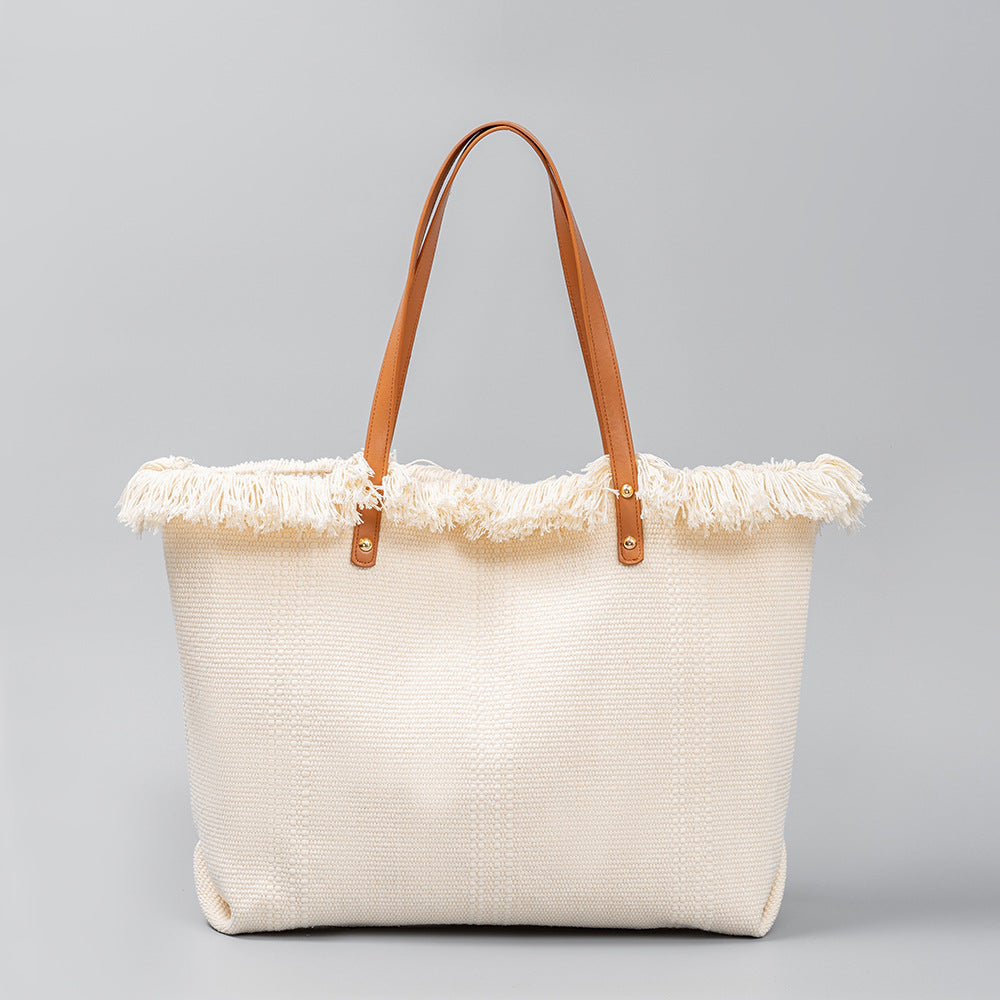 Bolso tote chic de lona con bordes con flecos